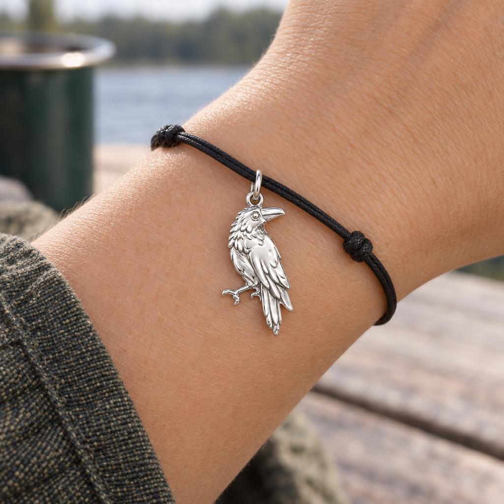 Mystic Raven Sentinel Charm Bracelet – Personalized Nature Gift – worn on the wrist on a black cord bracelet