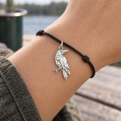 Mystic Raven Sentinel Charm Bracelet – Personalized Nature Gift – worn on the wrist on a black cord bracelet