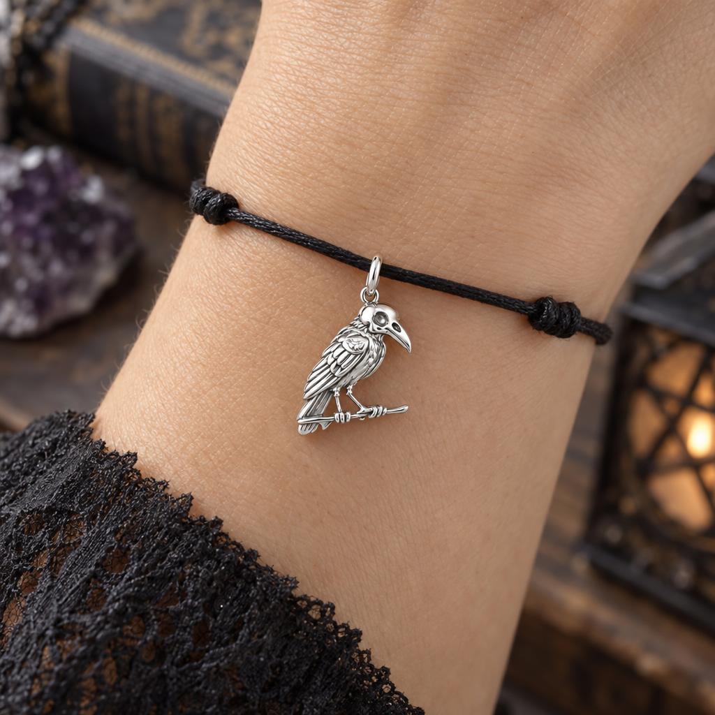 Mystic Raven Skull Charm Bracelet – Personalized Goth Gift – worn on the wrist on a black cord bracelet