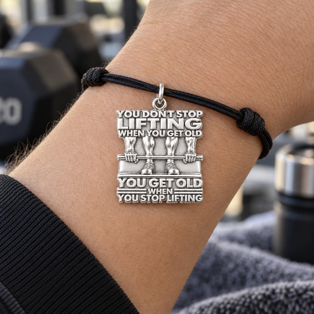 Never Stop Lifting Charm Bracelet – Personalized Athlete Gift – worn on the wrist on a black cord bracelet