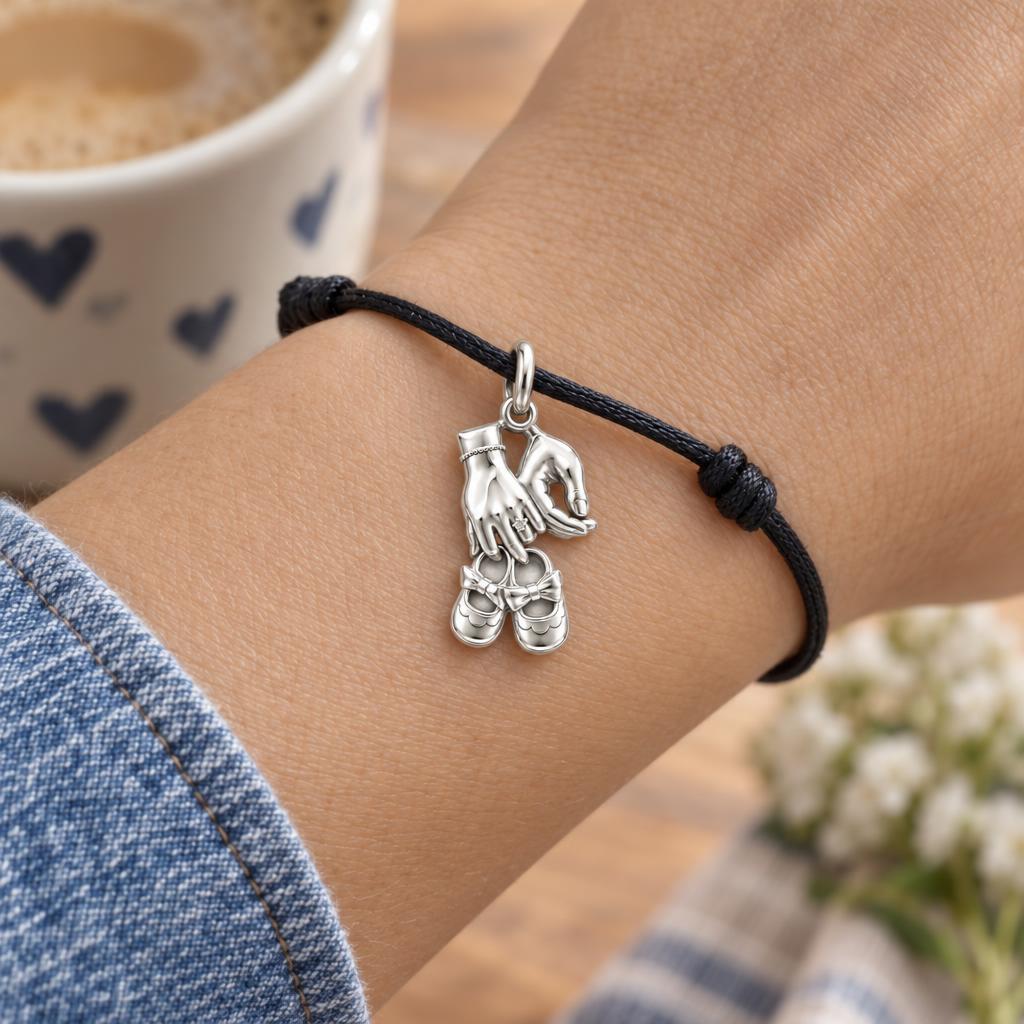 New Chapter Baby Shoes Charm Bracelet – Personalized Mom Gift – worn on the wrist on a black cord bracelet