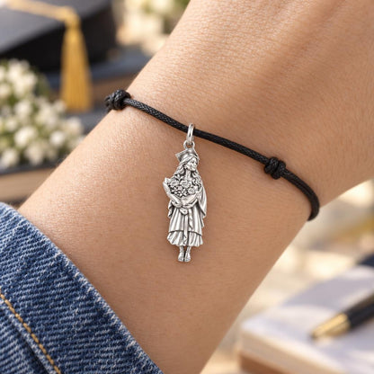 New Horizons Graduate Charm Bracelet – Personalized Daughter Gift – worn on the wrist on a black cord bracelet