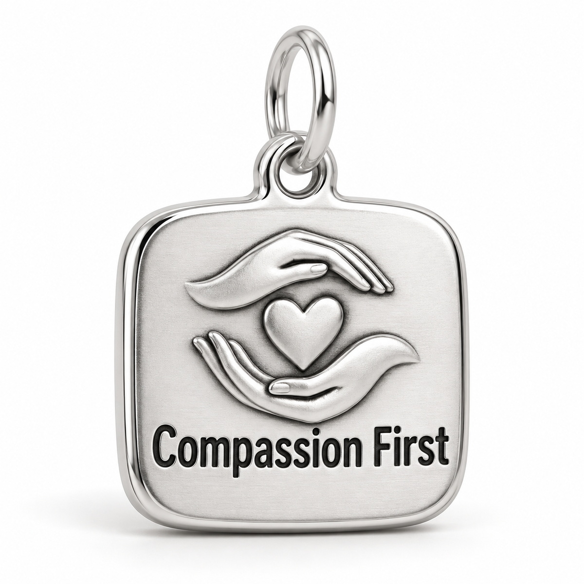 Compassion First Engraved Charm polished silver concept
