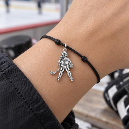 On The Ice Charm Bracelet – Personalized Hockey Mom Gift – worn on the wrist on a black cord bracelet