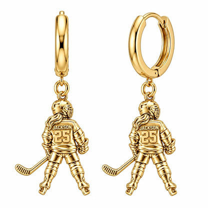 On The Ice Female Hockey Player Huggie Charm Earrings – 18K gold, front view