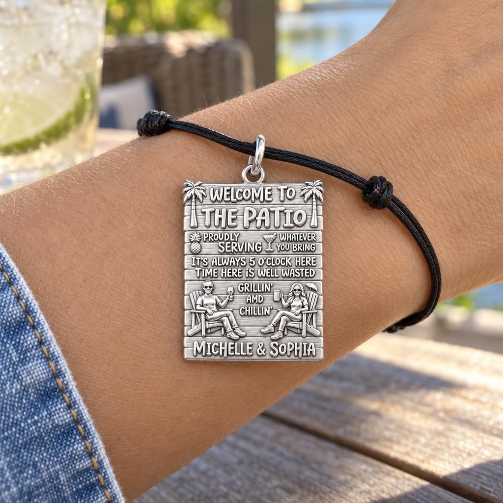 Patio Paradise Charm Bracelet – Personalized Couple Gift – worn on the wrist on a black cord bracelet