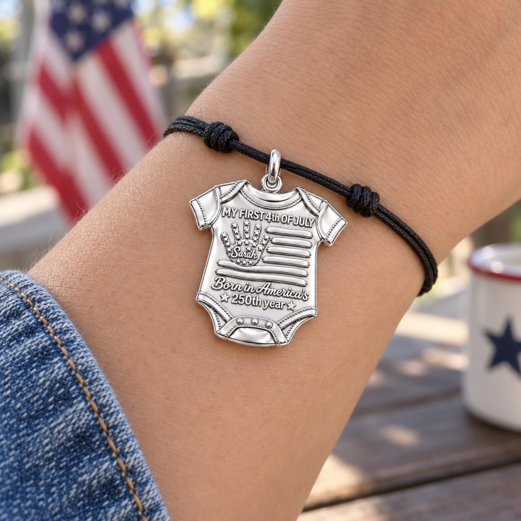 Patriotic Baby Onesie Charm Bracelet – Personalized Mom Gift – worn on the wrist on a black cord bracelet