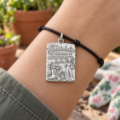 Plantaholic Recovery Charm Bracelet – Personalized Gardener Gift – worn on the wrist on a black cord bracelet