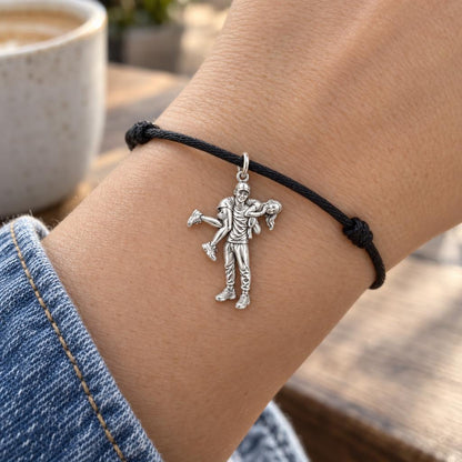 Playful Liftoff Charm Bracelet – Personalized Couple Gift – worn on the wrist on a black cord bracelet