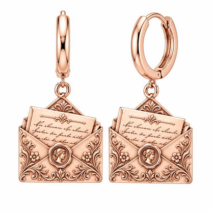 Pride and Prejudice Letter Huggie Charm Earrings – rose gold, front view
