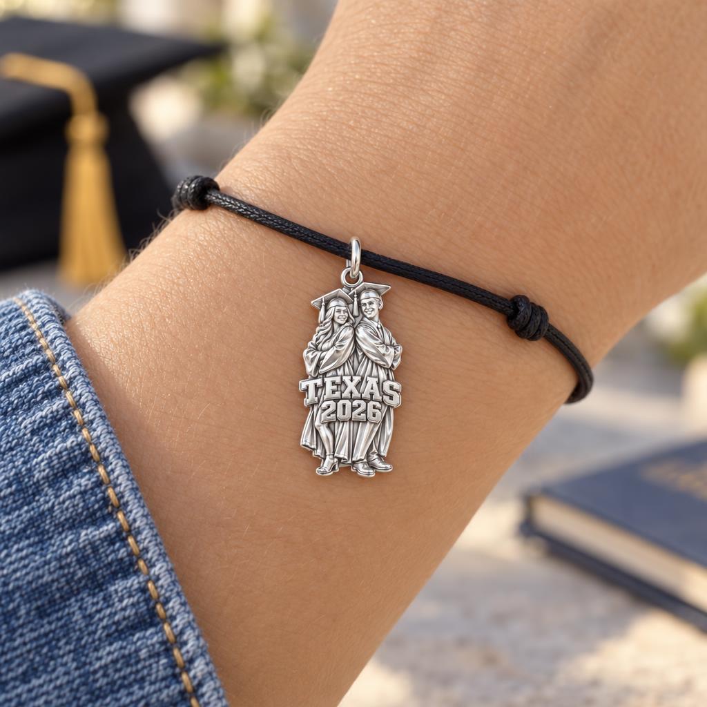 Proud Graduate Milestone Charm Bracelet – Personalized Grad Gift – worn on the wrist on a black cord bracelet