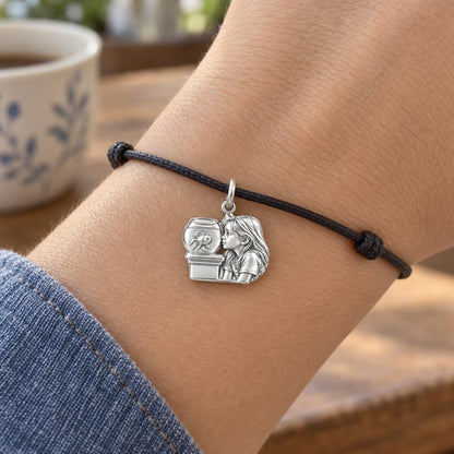 Quiet Reflection Goldfish Charm Bracelet – Personalized Mom Gift – worn on the wrist on a black cord bracelet