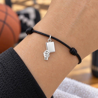 Raised Victory Sign Charm Bracelet – Personalized Coach Gift – worn on the wrist on a black cord bracelet