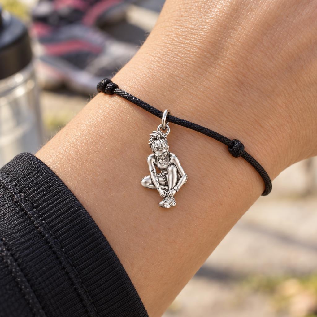 Resilient Runner Charm Bracelet – Personalized Athlete Gift – worn on the wrist on a black cord bracelet