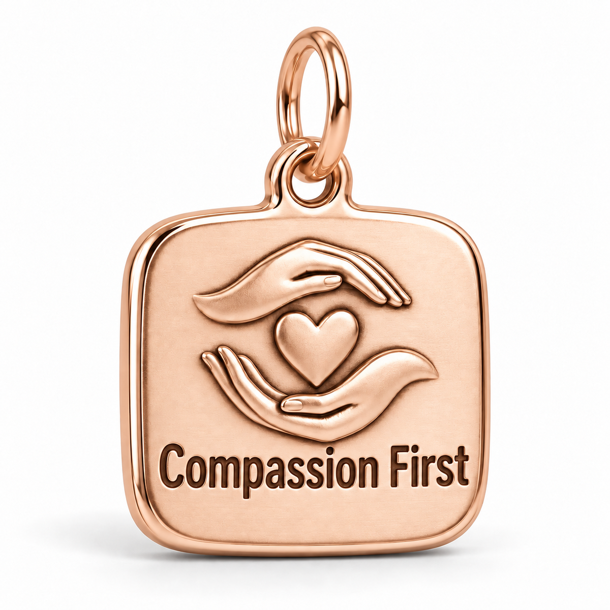Compassion First Engraved Nurse Charm | polished rose gold material view | 53ab4f07b4556454a9a02236f0cc4ee144fd85a7159411c8964d46b6afa9a645