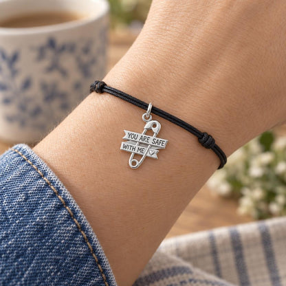Safe With Me Safety Pin Charm Bracelet – Personalized Mom Gift – worn on the wrist on a black cord bracelet