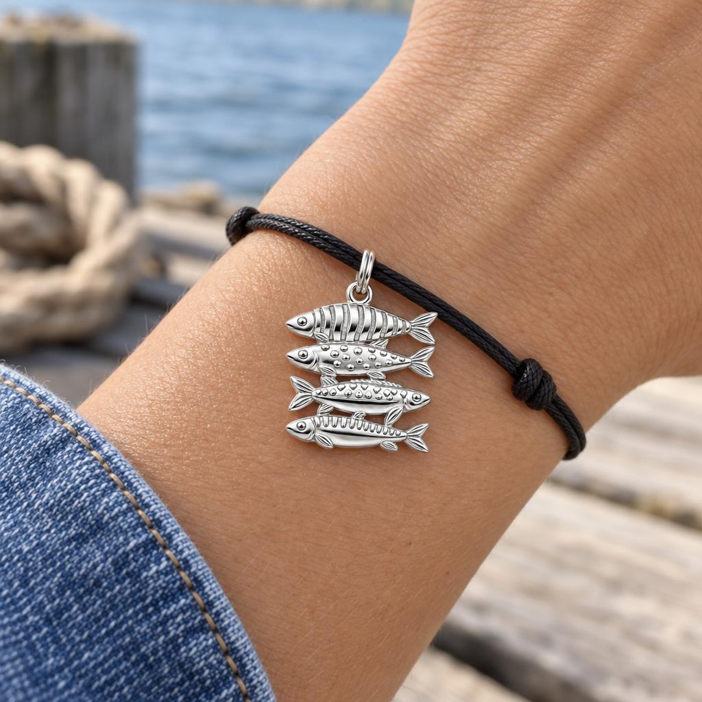 School of Four Fish Charm Bracelet – Personalized Mom Gift – worn on the wrist on a black cord bracelet