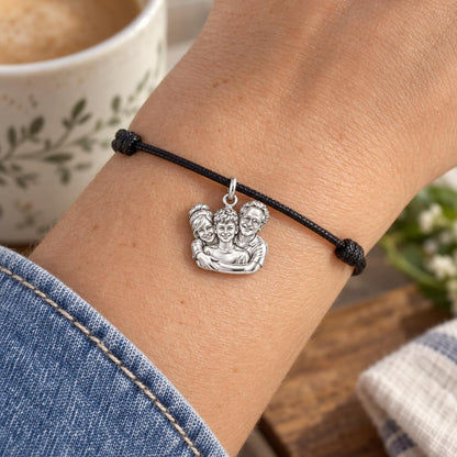 Sculpted Family Portrait Charm Bracelet – Personalized Mom Gift – worn on the wrist on a black cord bracelet
