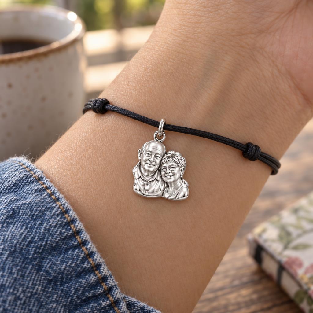 Sculpted Together Portrait Charm Bracelet – Personalized Couple Gift – worn on the wrist on a black cord bracelet