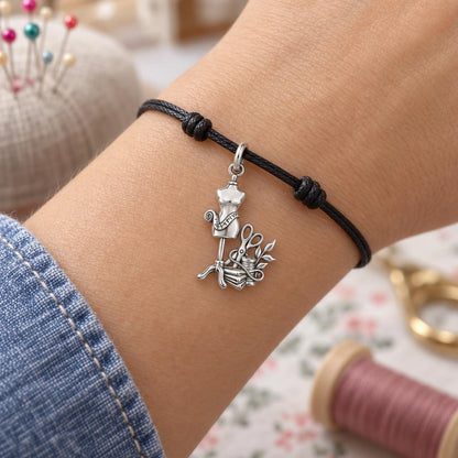 Seamstress Studio Essentials Charm Bracelet – Personalized Maker Gift – worn on the wrist on a black cord bracelet