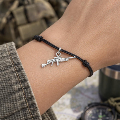 Sharpshooter Sniper Charm Bracelet – Personalized Veteran Gift – worn on the wrist on a black cord bracelet