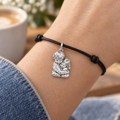 Sibling Sweet Embrace Charm Bracelet – Personalized Mom Gift – worn on the wrist on a black cord bracelet