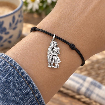 Sibling Sweetheart Hug Charm Bracelet – Personalized Mom Gift – worn on the wrist on a black cord bracelet