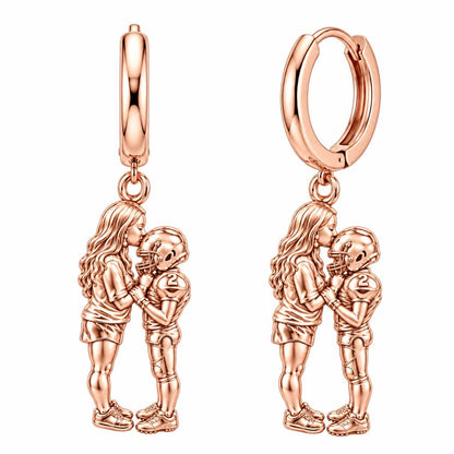 Sideline Kiss Football Huggie Charm Earrings – rose gold, front view