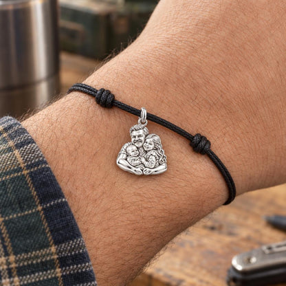 Silver Family Embrace Charm Bracelet – Personalized Dad Gift – worn on the wrist on a black cord bracelet