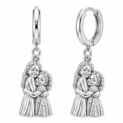 Sisterly Embrace Huggie Charm Earrings – silver, front view