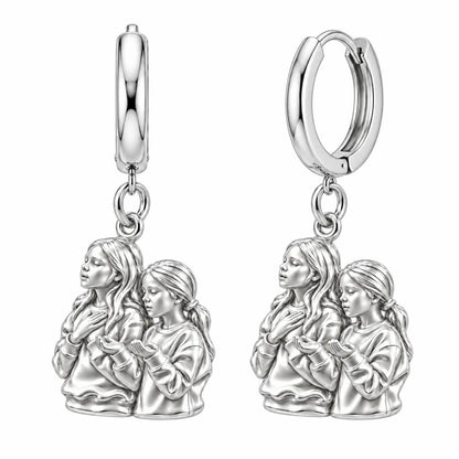 Sisters in Prayer Huggie Charm Earrings – silver, front view