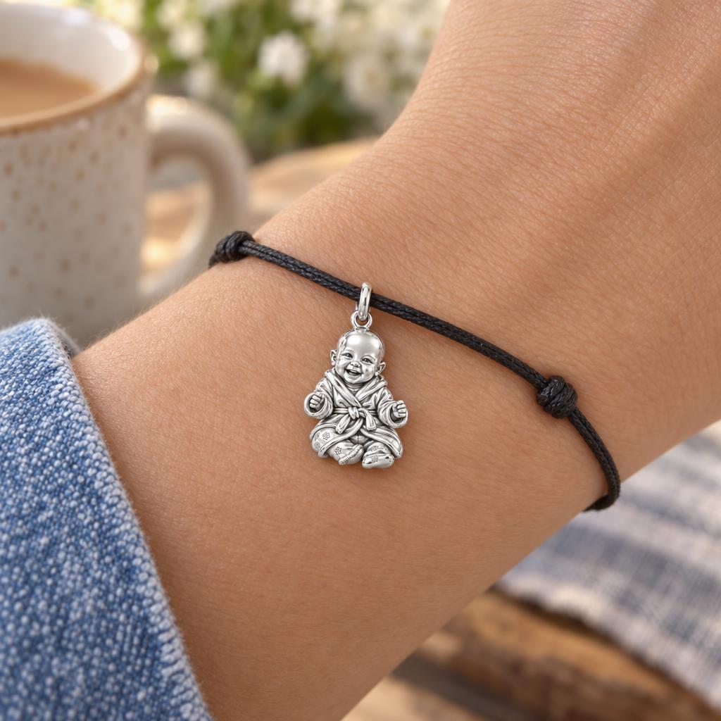 Smiling Baby Monk Charm Bracelet – Personalized Mom Gift – worn on the wrist on a black cord bracelet