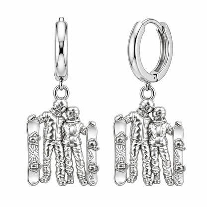 Snowboard Couple in Gear Huggie Charm Earrings – silver, front view