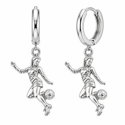 Soccer Girl in Motion Huggie Charm Earrings – silver, front view