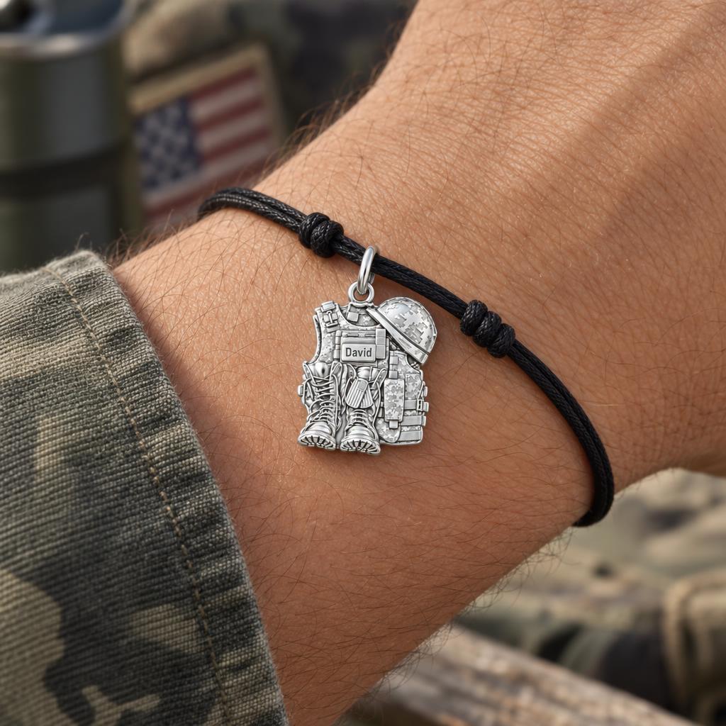 Soldier's Gear Tribute Charm Bracelet – Personalized Veteran Gift – worn on the wrist on a black cord bracelet