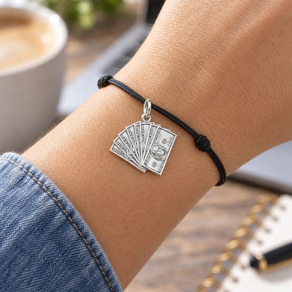Stacked Cash Fan Charm Bracelet – Personalized Hustler Gift – worn on the wrist on a black cord bracelet
