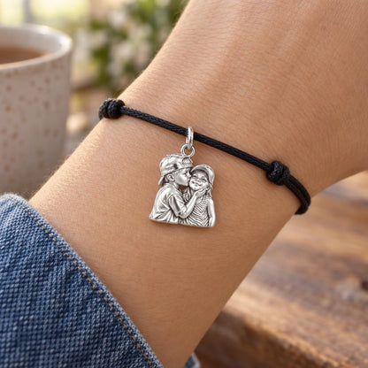 Sweet Sibling Kiss Charm Bracelet – Personalized Mom Gift – worn on the wrist on a black cord bracelet