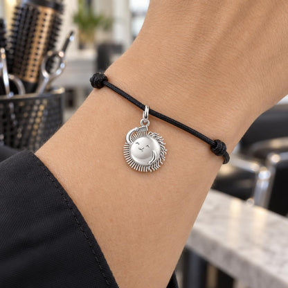 Taming the Rays Charm Bracelet – Personalized Hairstylist Gift – worn on the wrist on a black cord bracelet