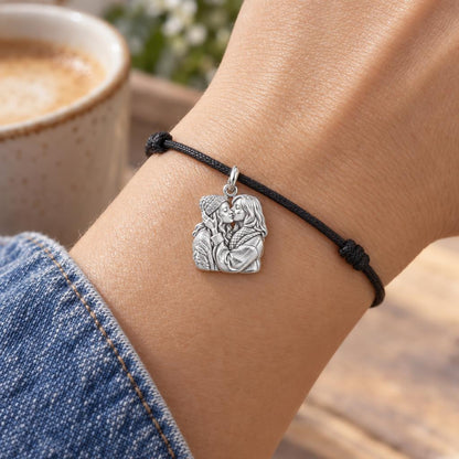 Tender Embrace Charm Bracelet – Personalized Couple Gift – worn on the wrist on a black cord bracelet