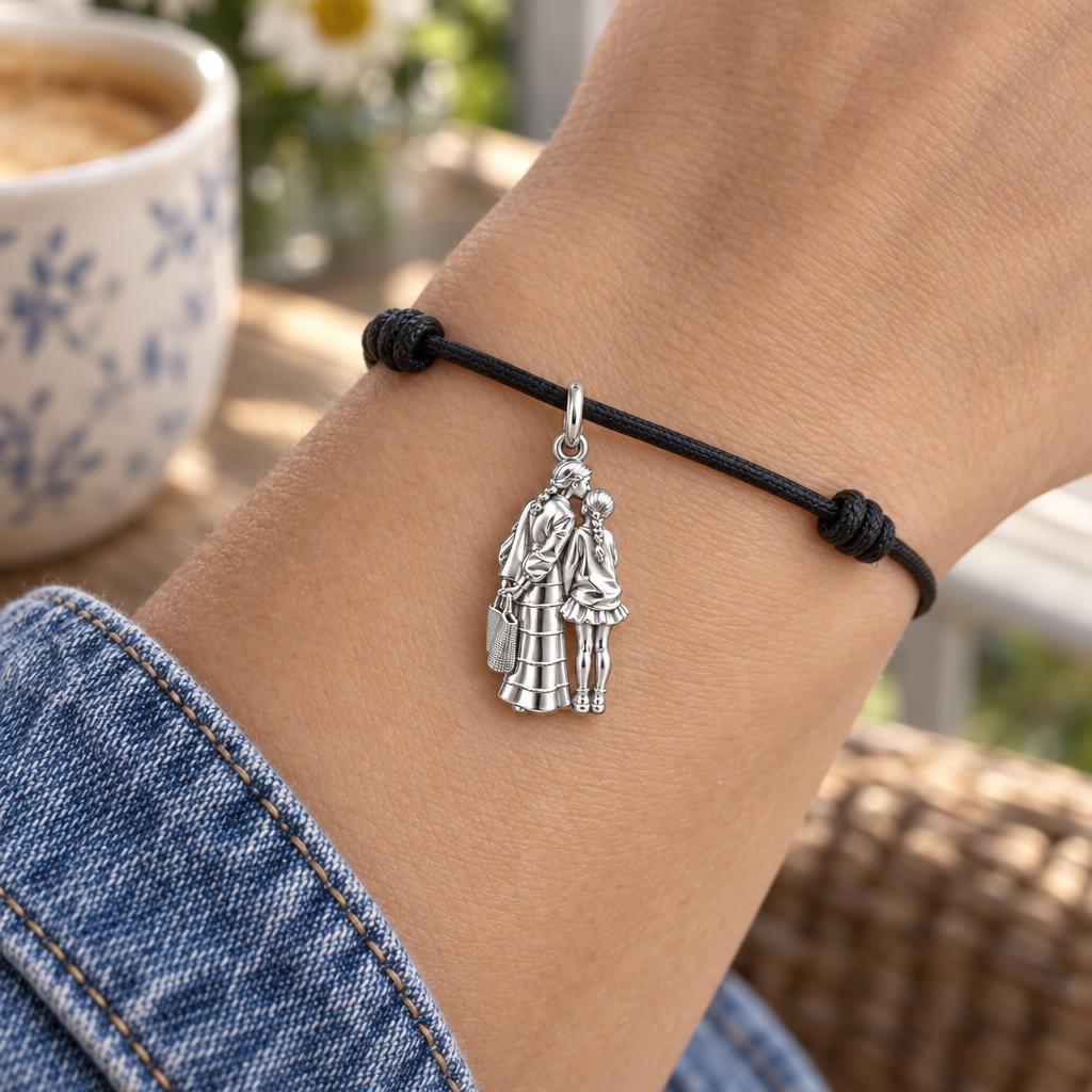 Tender Kiss and Connection Charm Bracelet – Personalized Mom Gift – worn on the wrist on a black cord bracelet