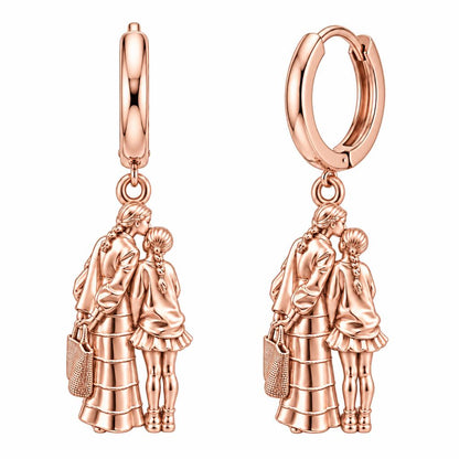 Tender Kiss and Connection Huggie Charm Earrings – rose gold, front view
