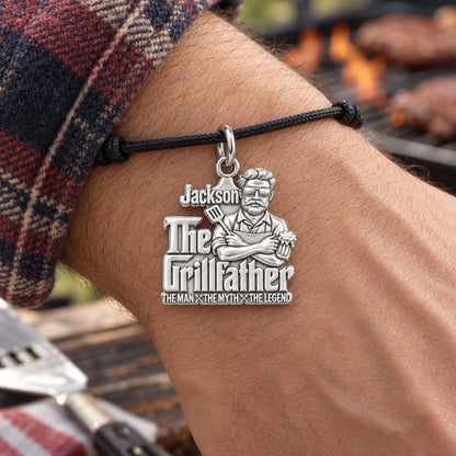 The Grillfather Charm Bracelet – Personalized Dad Gift – worn on the wrist on a black cord bracelet