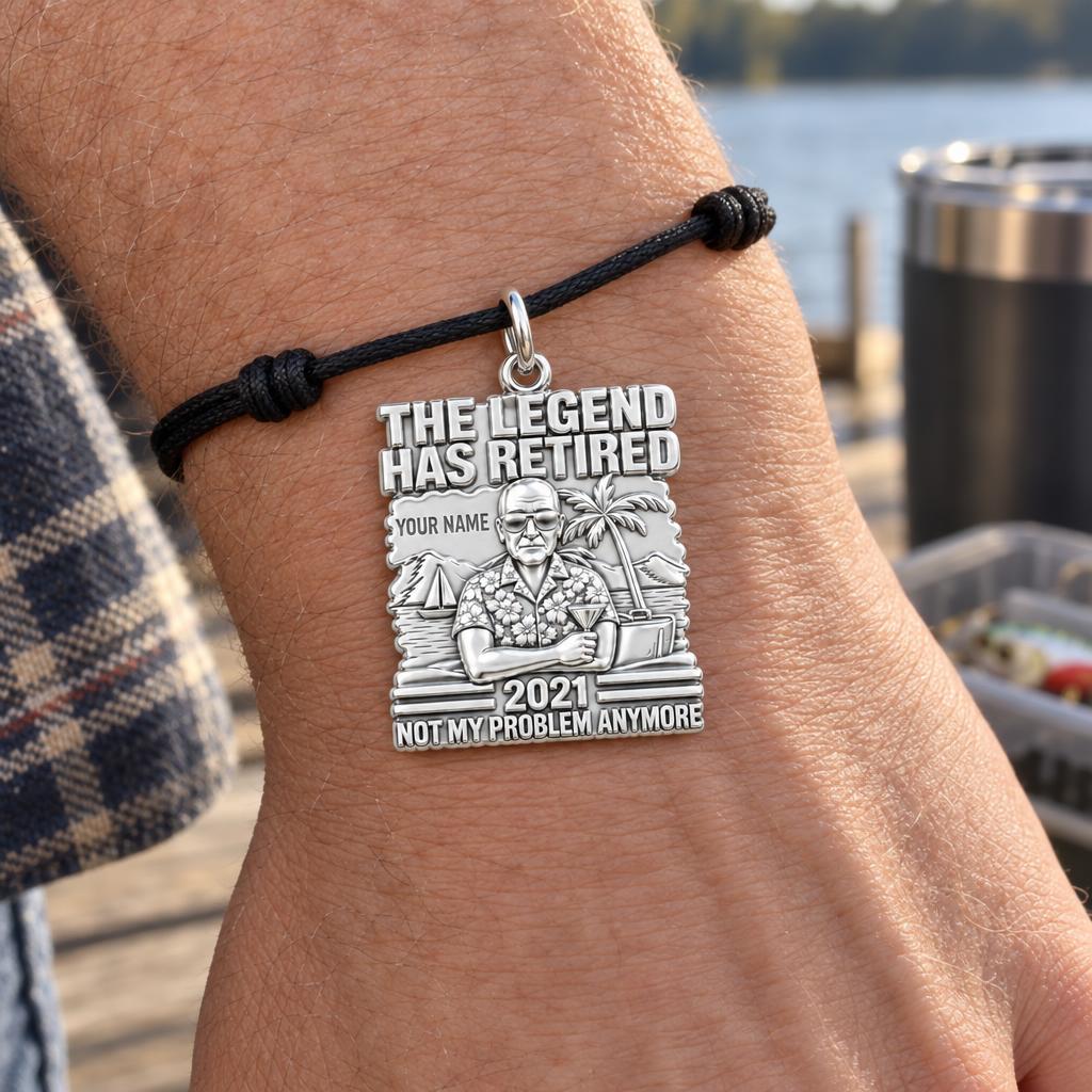 The Retired Legend Charm Bracelet – Personalized Retiree Gift – worn on the wrist on a black cord bracelet