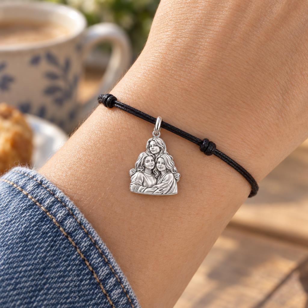 Three Sisters Huddle Charm Bracelet – Personalized Mom Gift – worn on the wrist on a black cord bracelet