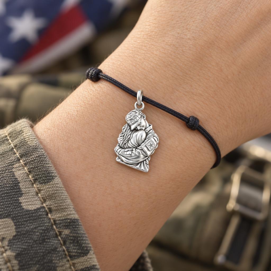 To My Hero: Brave Heart Homecoming Charm Bracelet – worn on the wrist on a black cord bracelet