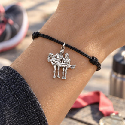 Triumphant Team Finish Charm Bracelet – Personalized Athlete Gift – worn on the wrist on a black cord bracelet