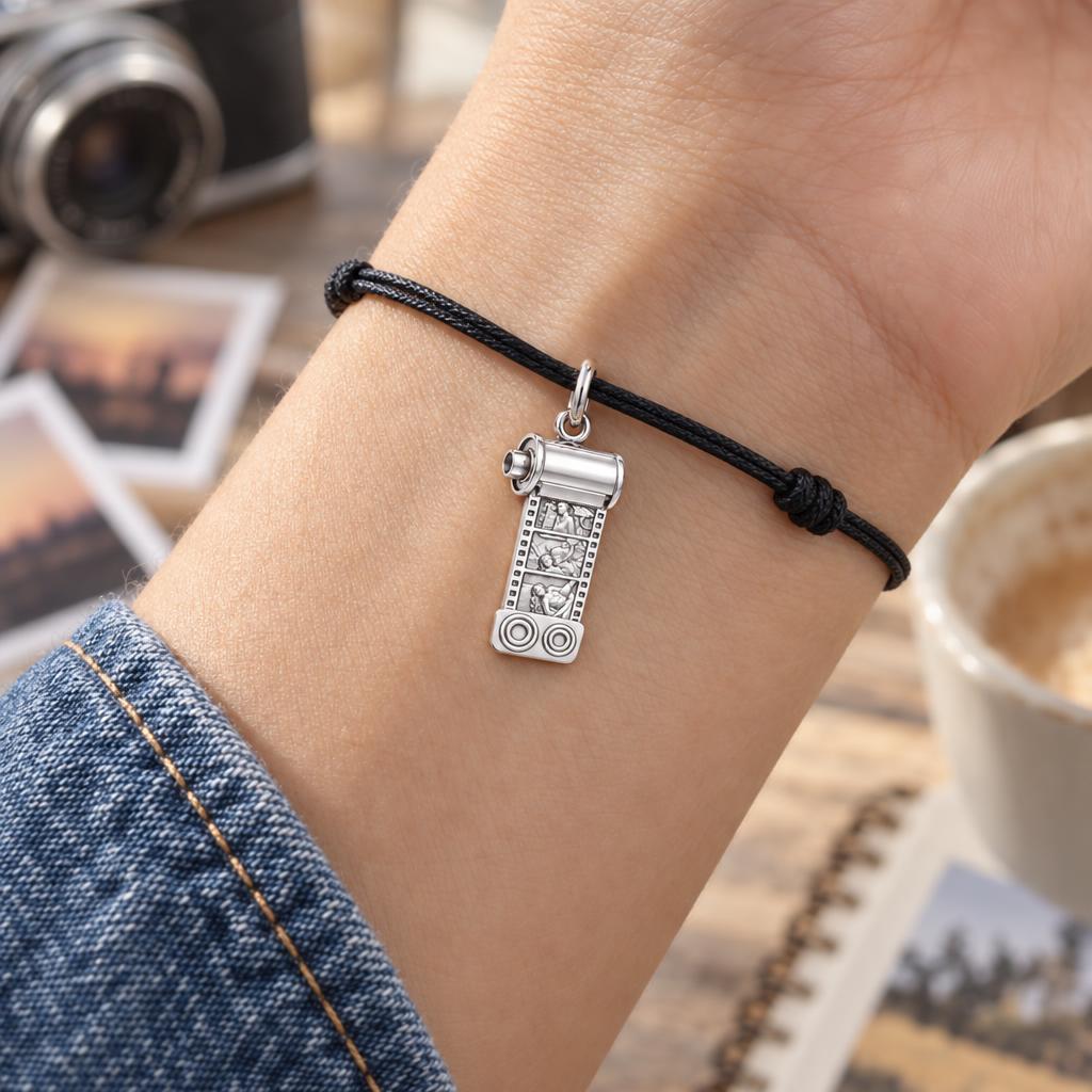 Vintage Film Roll Charm Bracelet – Personalized Mom Gift – worn on the wrist on a black cord bracelet