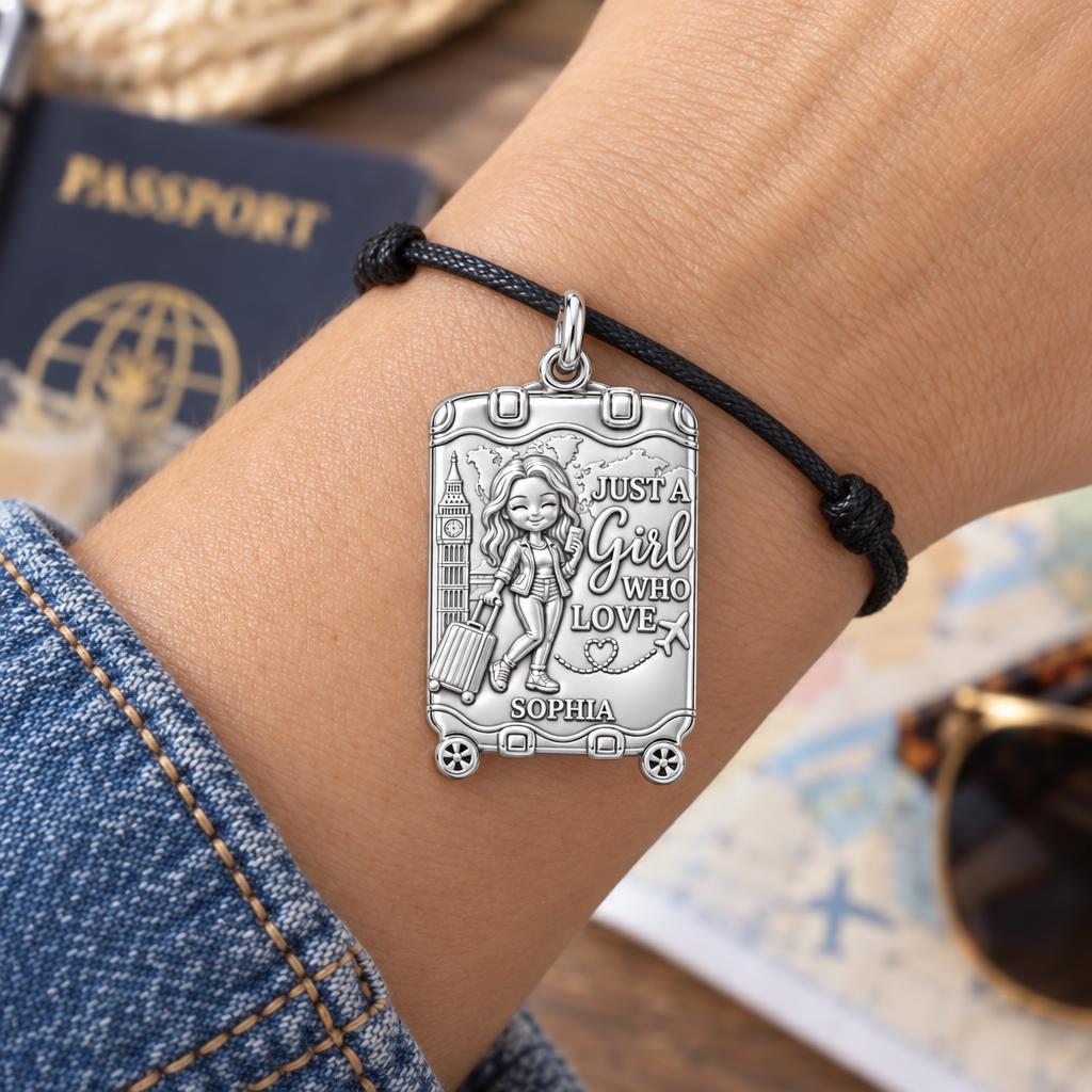 Wanderlust Suitcase Charm Bracelet – Personalized Traveler Gift – worn on the wrist on a black cord bracelet