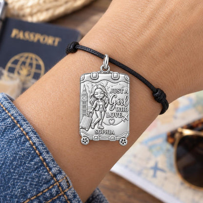 Wanderlust Suitcase Charm Bracelet – Personalized Traveler Gift – worn on the wrist on a black cord bracelet