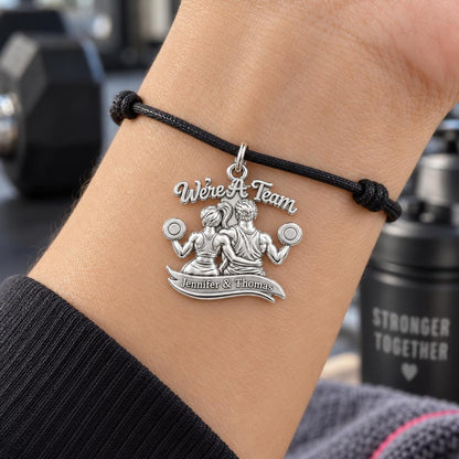 We're A Team Gym Couple Charm Bracelet – Personalized Couple Gift – worn on the wrist on a black cord bracelet